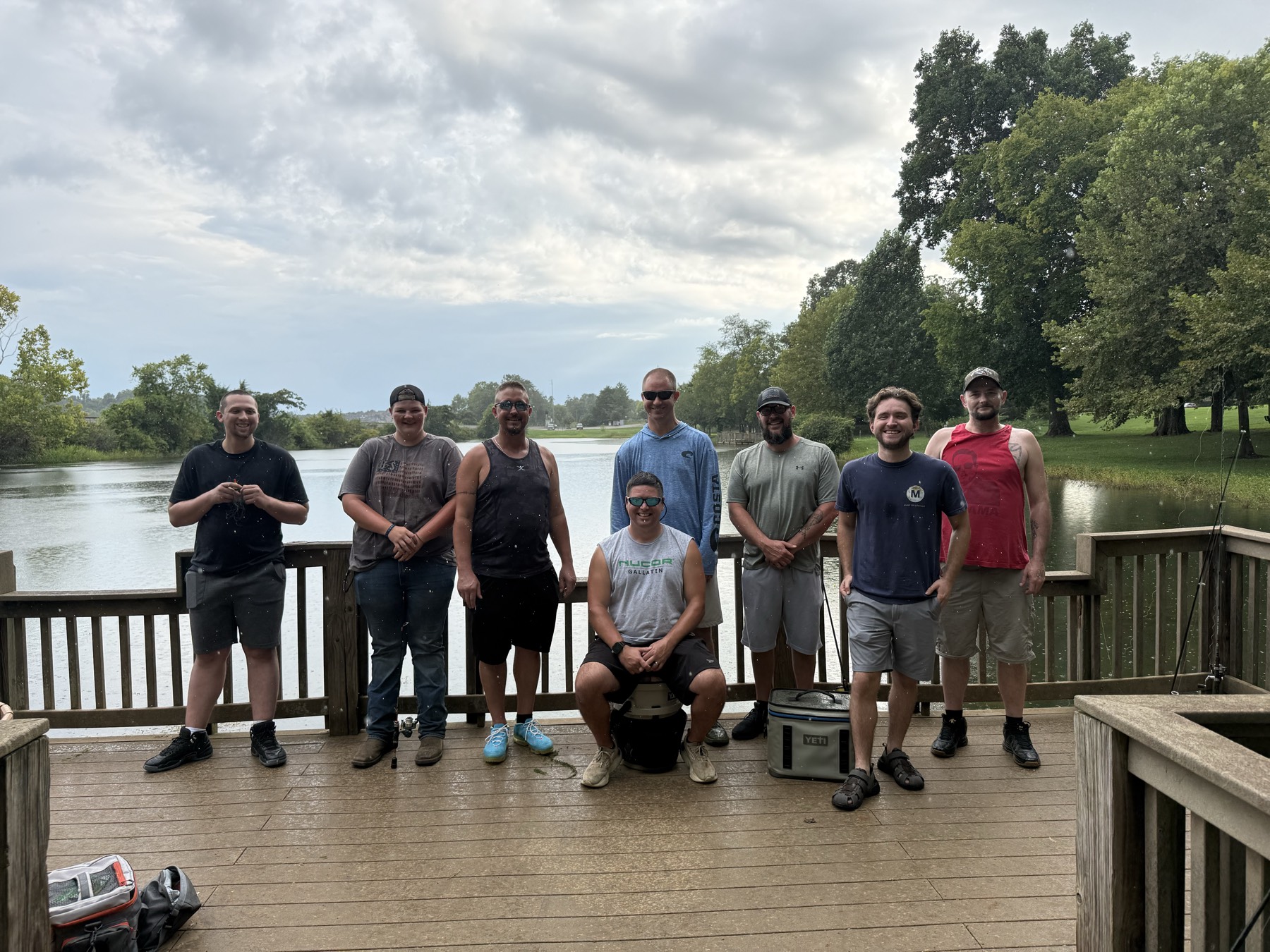 A group of Woodsmen men together on a dock beside an East Tennessee lake